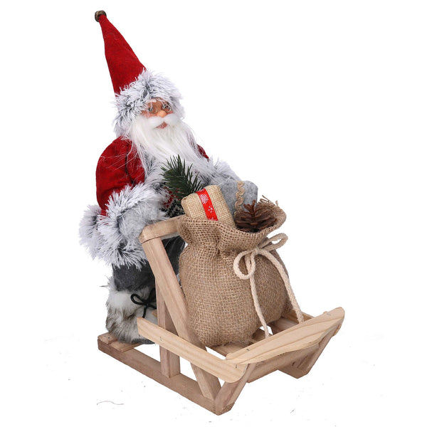 prezzo Weihnachtsmannpuppe aus Stoff mit graurotem Geschenkschlitten 33x12xh30 cm